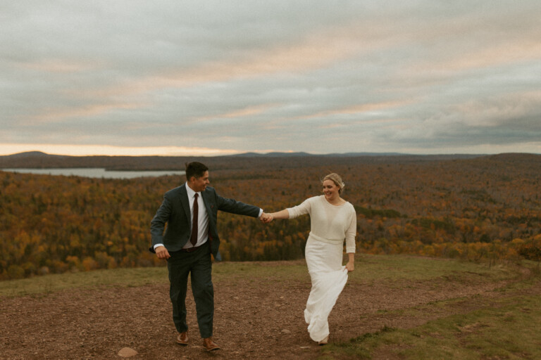 bride and groom in dress and suit on brockway mountain in copper harbor michigan