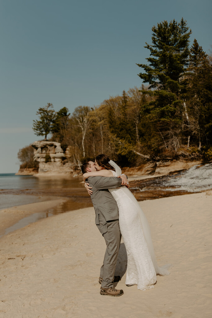 bride and groom on their elopement day at chapel rock in pictured rocks national lakeshore